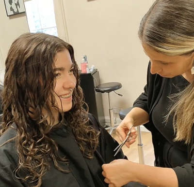 With the Deva haircut, the curls are shaped to naturally frame the face